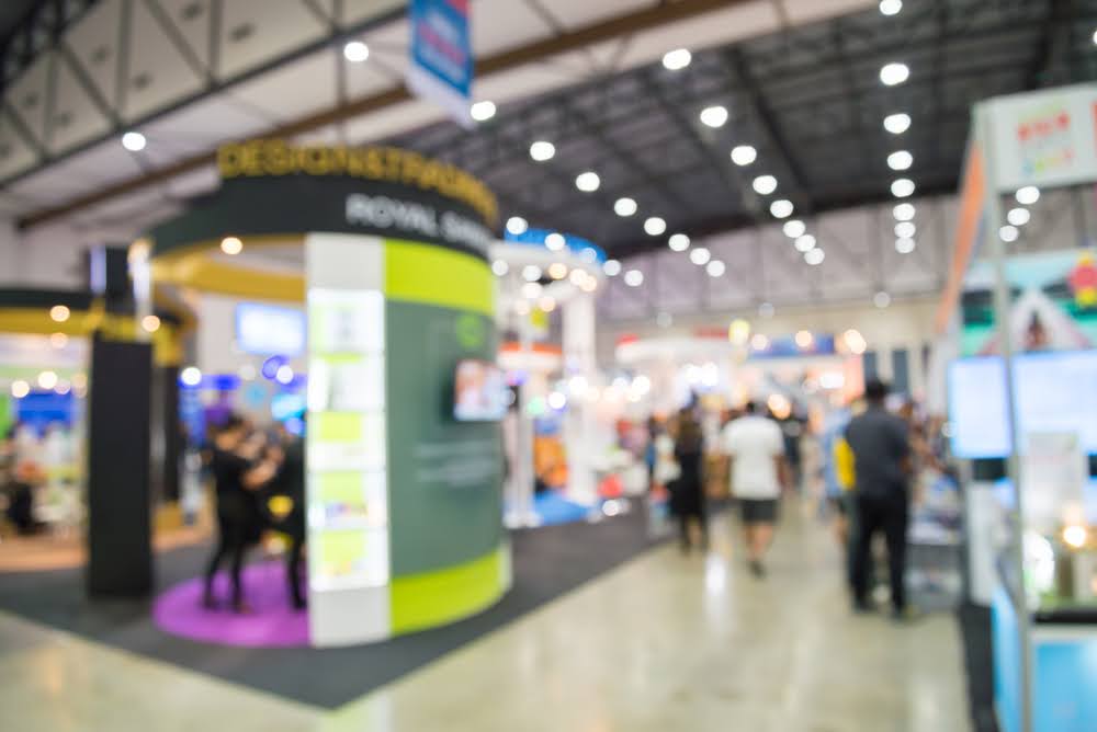 Attendees scanning QR codes for trade shows.